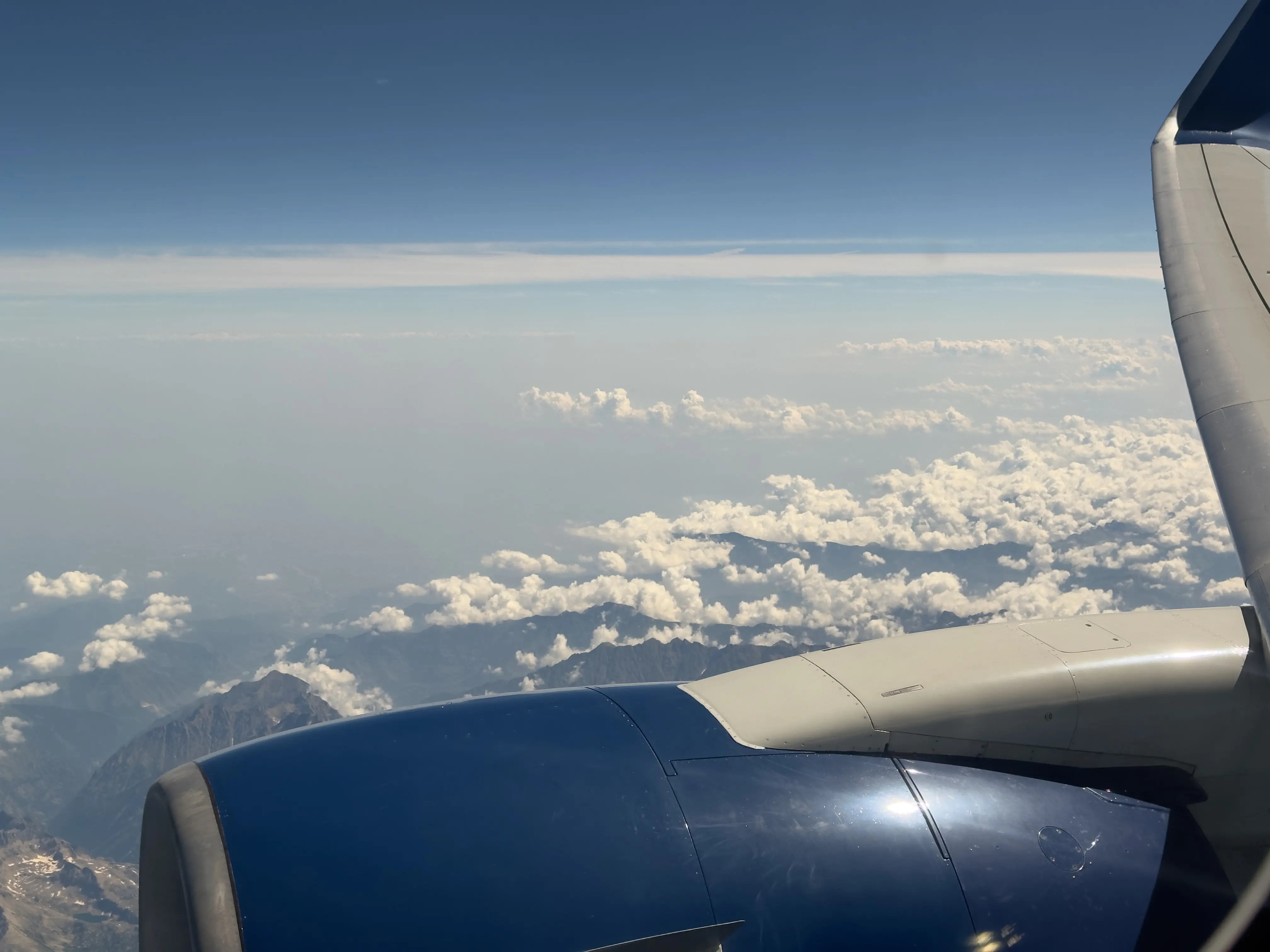 A view of mountains from inside a plane